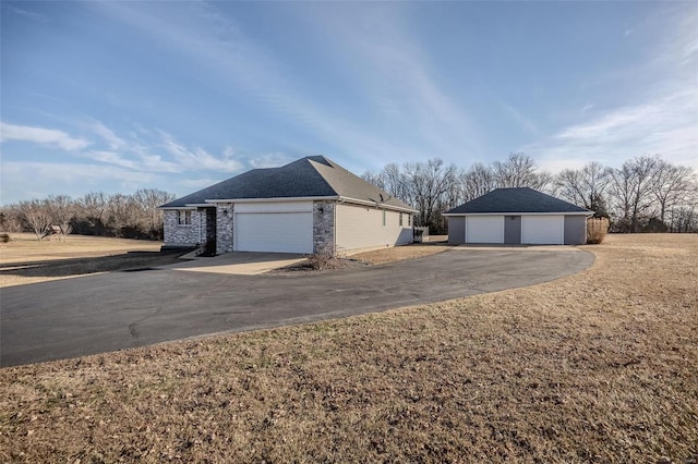 view of side of property featuring a garage