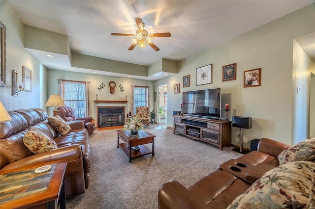 carpeted living room featuring ceiling fan