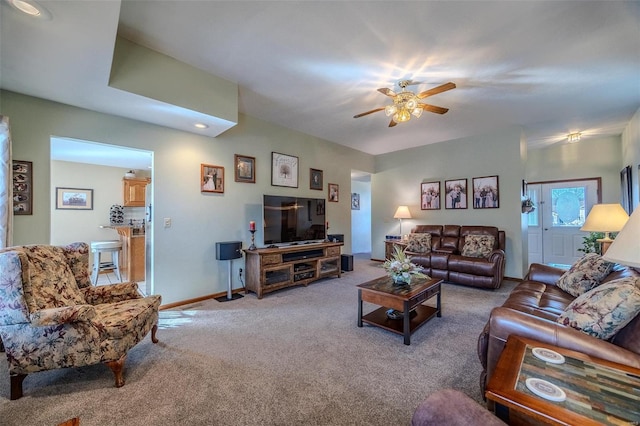 carpeted living room with ceiling fan