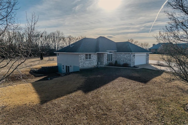 back of property featuring a garage