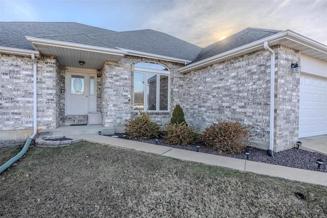 view of exterior entry featuring a garage