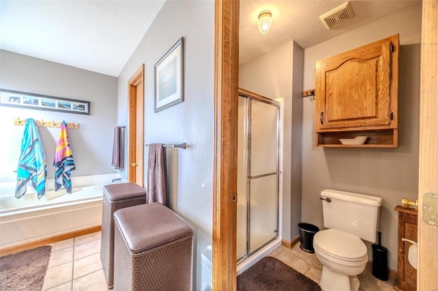 bathroom featuring tile patterned flooring, plus walk in shower, and toilet