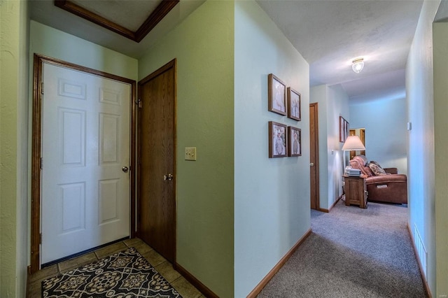 corridor with light colored carpet