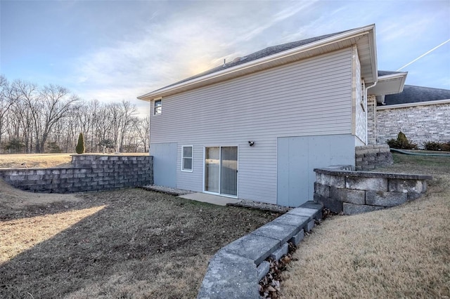 rear view of house with a yard