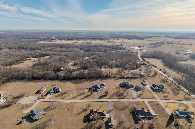 birds eye view of property with a rural view