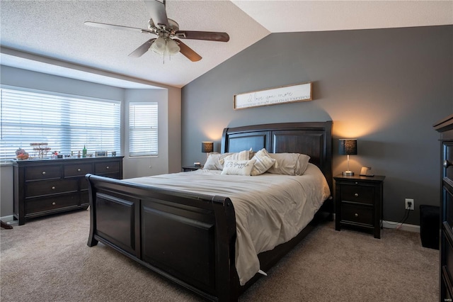 carpeted bedroom featuring lofted ceiling and ceiling fan