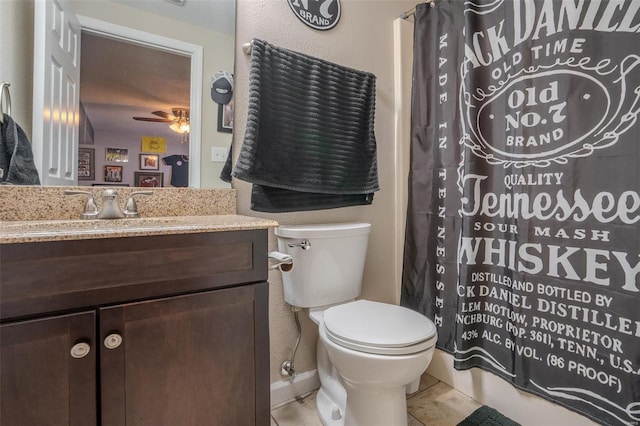 bathroom featuring tile patterned floors, toilet, a shower with curtain, vanity, and ceiling fan