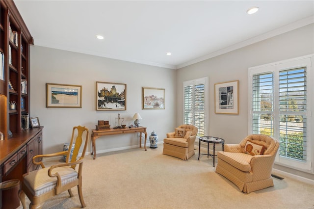 home office featuring light carpet, crown molding, and a healthy amount of sunlight