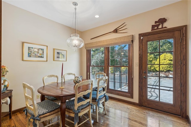 dining space with light wood-type flooring