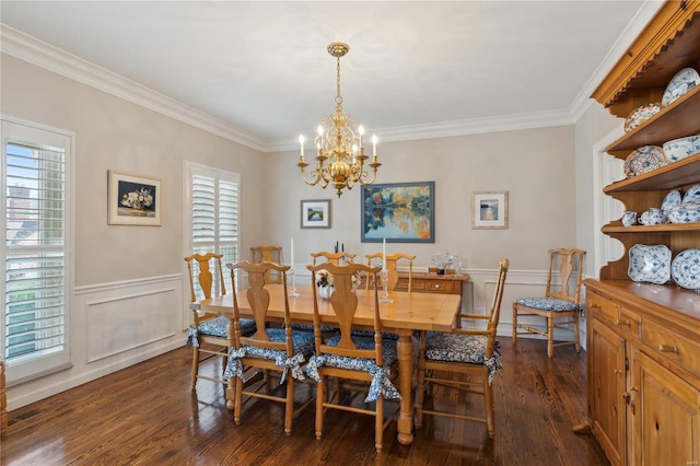 dining space featuring crown molding, an inviting chandelier, and dark hardwood / wood-style flooring