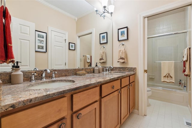 full bathroom with crown molding, enclosed tub / shower combo, vanity, tile patterned floors, and toilet