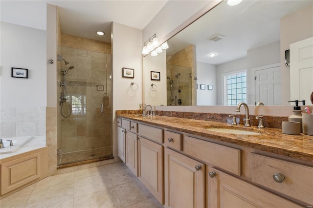 bathroom featuring vanity, tile patterned floors, and shower with separate bathtub