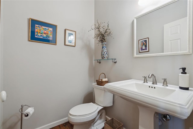 bathroom with toilet and sink