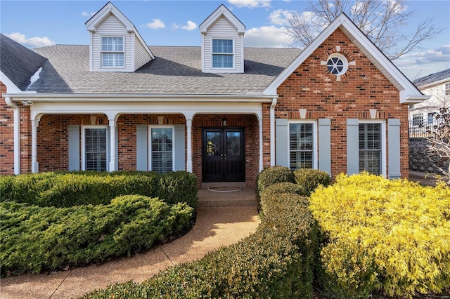 view of front of property featuring a porch and french doors