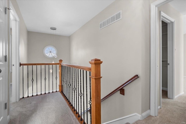 hallway with light carpet