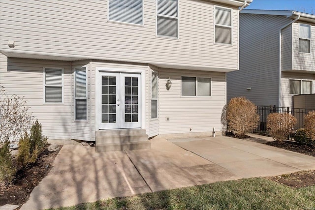 back of property featuring a patio and french doors