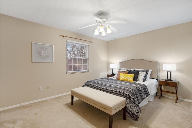 carpeted bedroom featuring a textured ceiling and ceiling fan