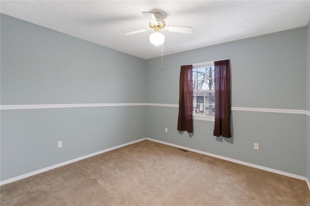 unfurnished room with carpet, a textured ceiling, and ceiling fan