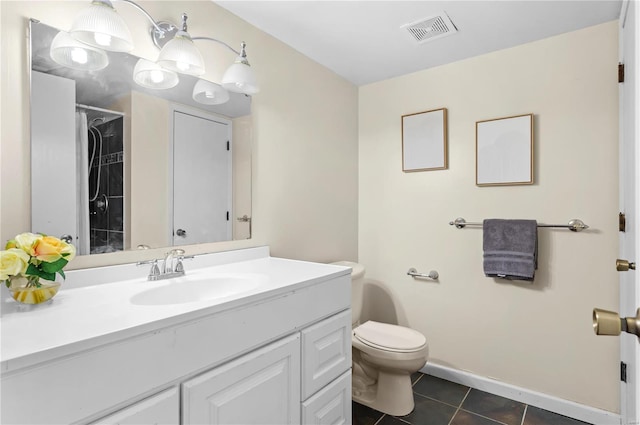 bathroom with tile patterned flooring, vanity, walk in shower, and toilet