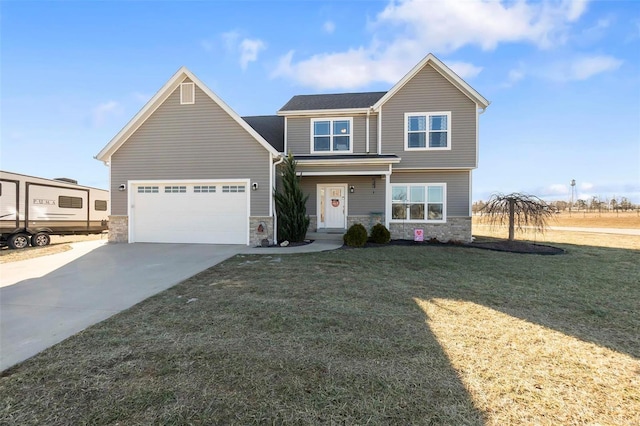 view of front of property with a garage and a front lawn