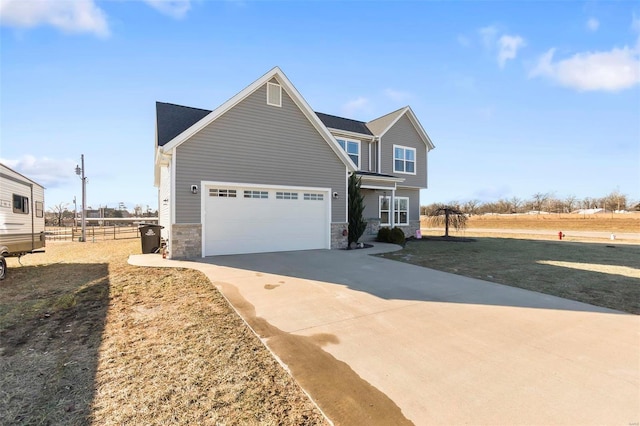 view of front facade featuring a garage and a front lawn