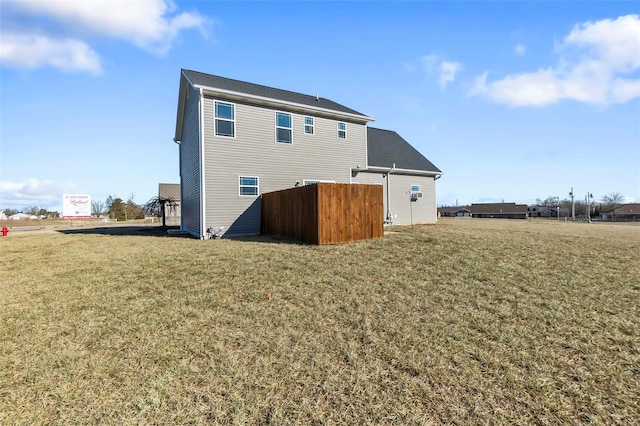 back of house featuring a yard