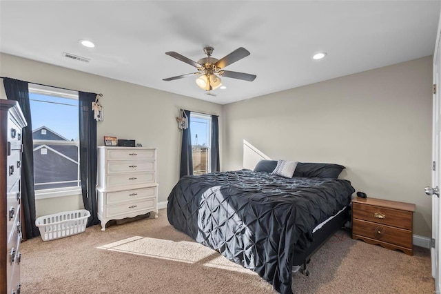 bedroom with ceiling fan and carpet