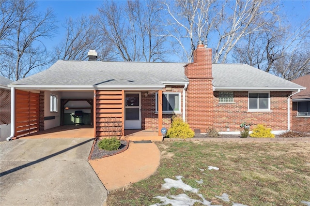 view of front of home featuring a carport