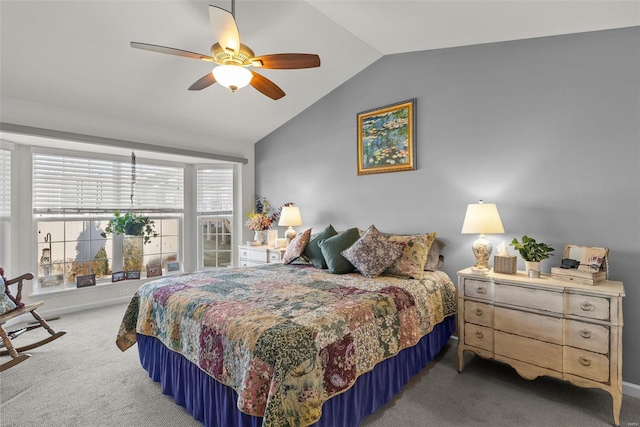 carpeted bedroom featuring lofted ceiling and ceiling fan