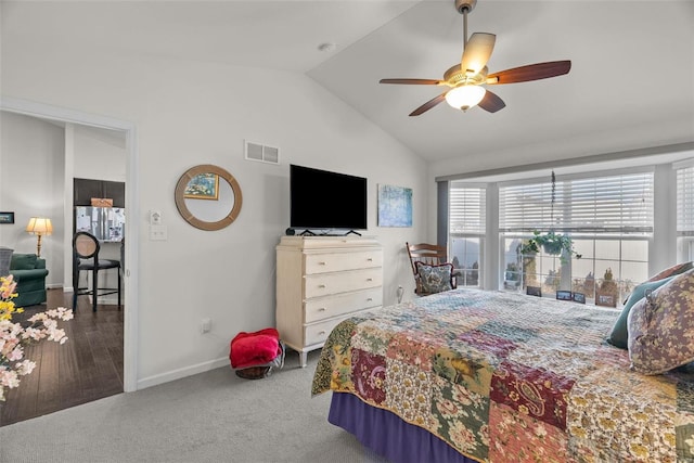 carpeted bedroom with lofted ceiling and ceiling fan