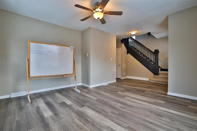 empty room featuring hardwood / wood-style floors and ceiling fan