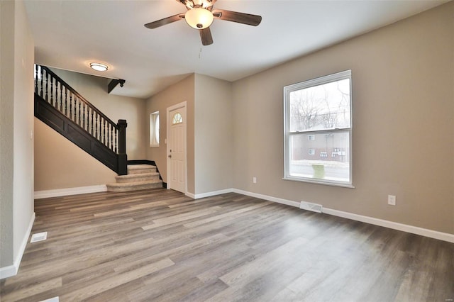 foyer entrance featuring hardwood / wood-style floors and ceiling fan