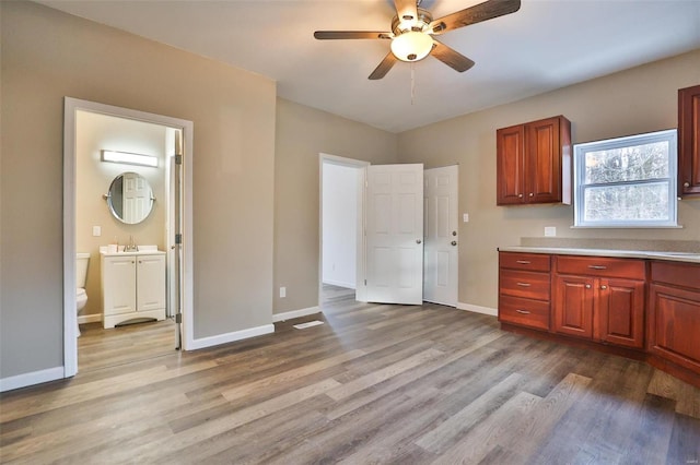 kitchen with light hardwood / wood-style flooring and ceiling fan