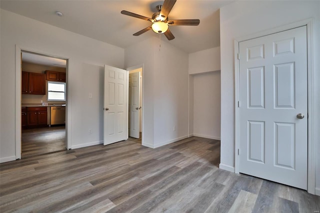 unfurnished bedroom featuring light wood-type flooring and ceiling fan