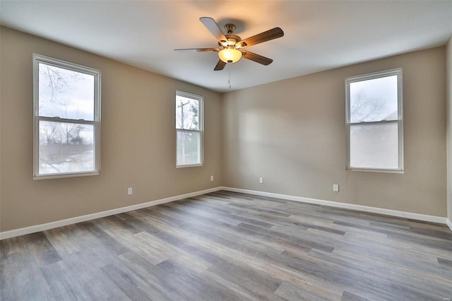 spare room with light hardwood / wood-style flooring and ceiling fan