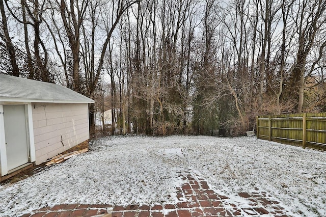 view of yard layered in snow