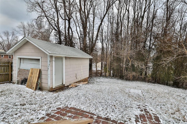 view of snow covered garage