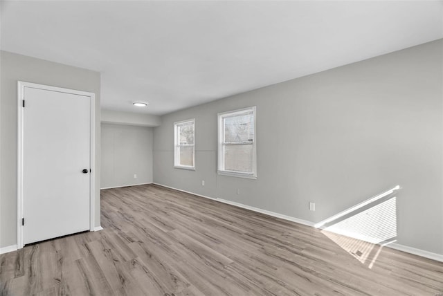 spare room featuring light hardwood / wood-style floors