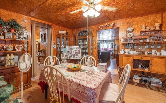 dining area featuring light wood-type flooring and ceiling fan