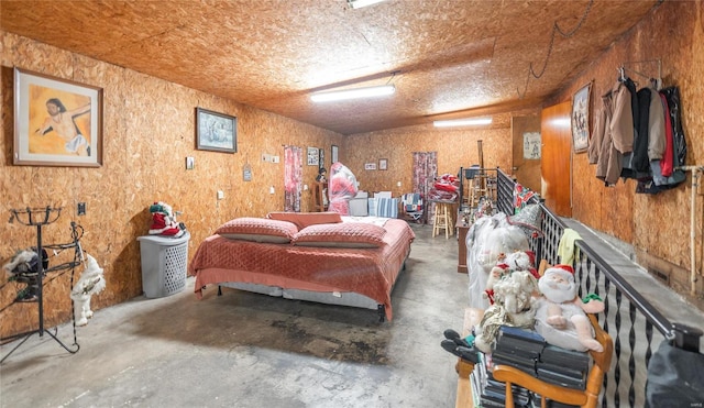 bedroom featuring concrete floors