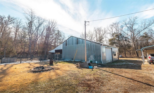 view of outbuilding featuring a yard and a carport