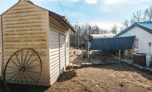 view of side of property featuring central AC unit