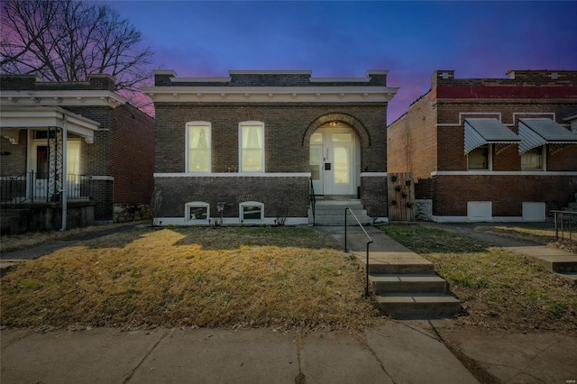 italianate house featuring brick siding