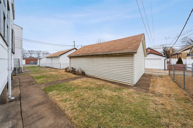 view of yard with a garage and an outdoor structure