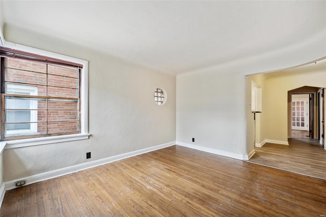 unfurnished room featuring hardwood / wood-style floors