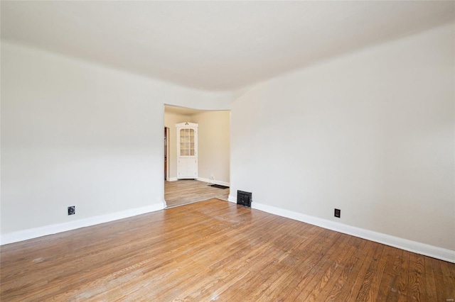 unfurnished room with light hardwood / wood-style floors