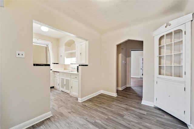 interior space featuring sink and light hardwood / wood-style floors