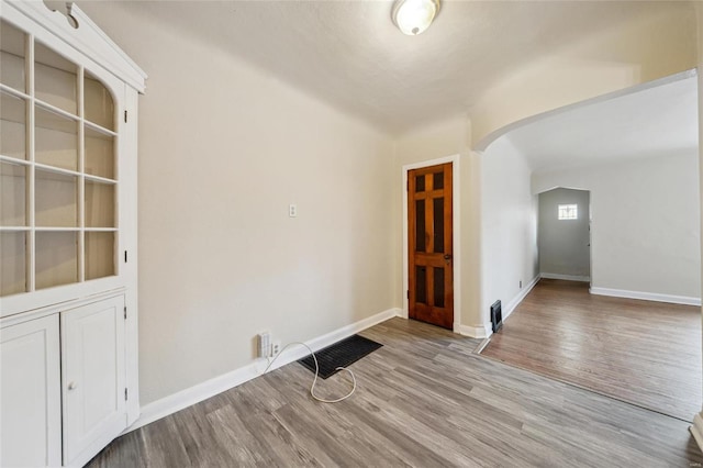 spare room featuring light wood-type flooring