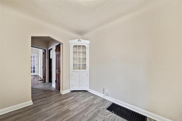 spare room with hardwood / wood-style floors