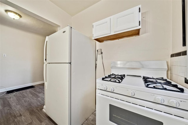 kitchen with white cabinetry, white appliances, and dark hardwood / wood-style flooring